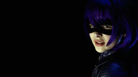 HD PC desktop wallpaper featuring Chloë Grace Moretz as Hit-Girl from the movie Kick-Ass, showcasing her masked face and purple hair against a dark background.