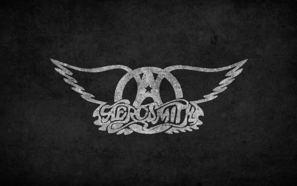 HD desktop wallpaper featuring the classic Aerosmith logo with wings on a textured dark background, capturing the essence of the iconic rock band and music.