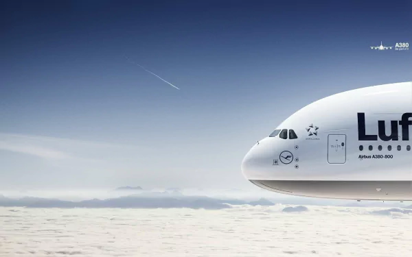 A close-up view of a Lufthansa Airbus A380 soaring above the clouds, set against a clear blue sky, featured as a high-definition desktop wallpaper.