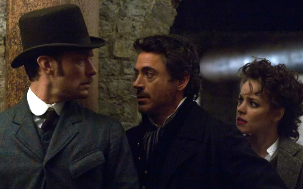 HD PC desktop wallpaper featuring Rachel McAdams, Jude Law, and Robert Downey Jr. in a scene from the movie Sherlock Holmes.