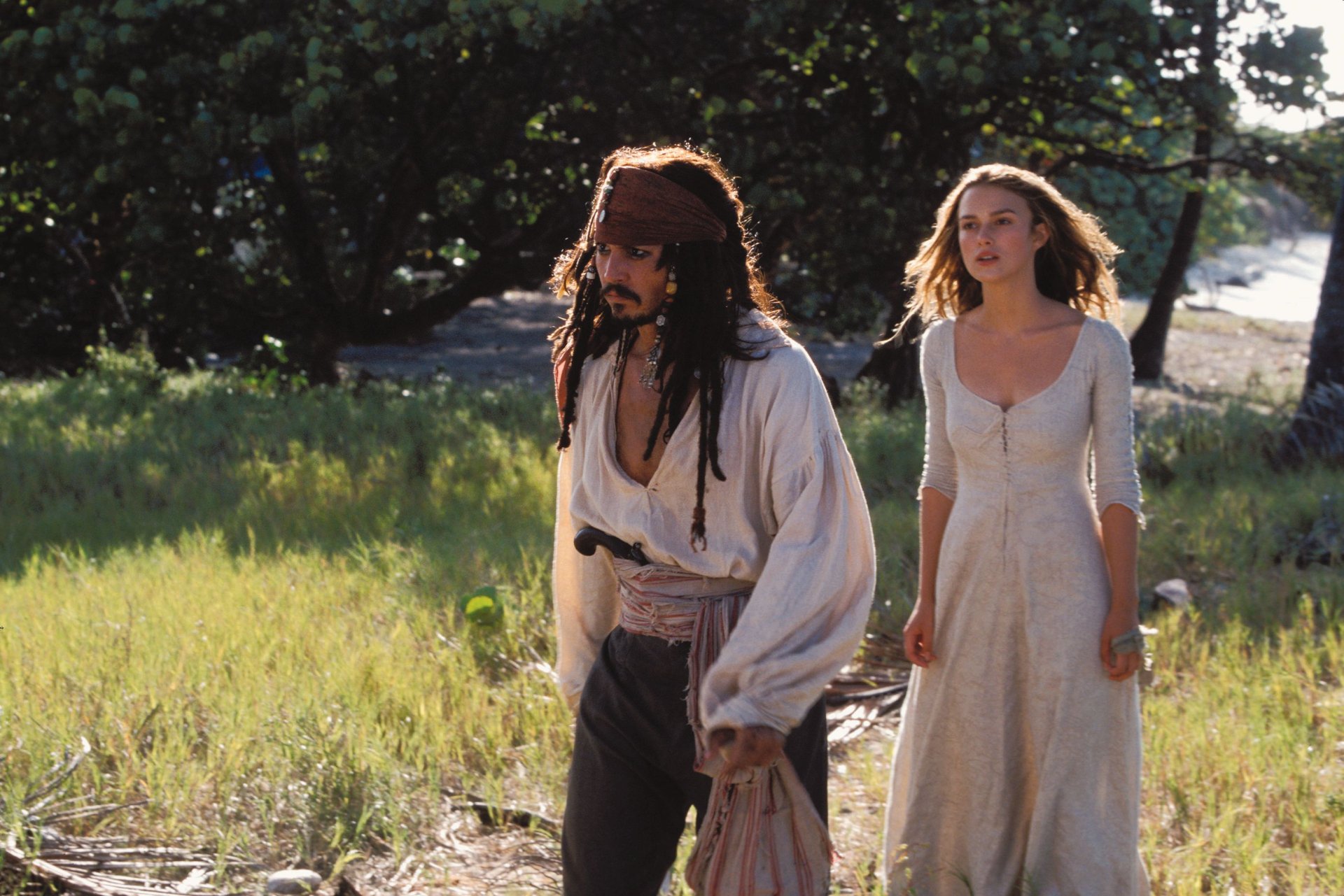 HD desktop wallpaper featuring Jack Sparrow (Johnny Depp) and Elizabeth Swann (Keira Knightley) from the movie Pirates of the Caribbean: The Curse of the Black Pearl.