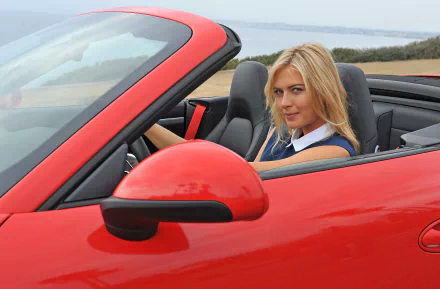 HD PC desktop wallpaper featuring Maria Sharapova seated in a red convertible sports car, showcasing a sleek and sporty vibe.