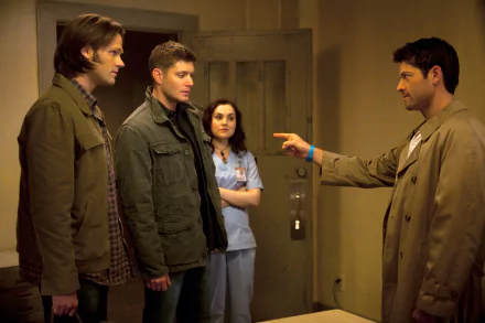 A scene from *Supernatural* featuring Sam Winchester (Jared Padalecki), Dean Winchester (Jensen Ackles), and Castiel (Misha Collins) with Meg Masters in a dramatic moment.