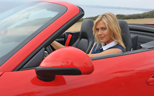 HD PC desktop wallpaper featuring Maria Sharapova seated in a red convertible sports car, showcasing a sleek and sporty vibe.