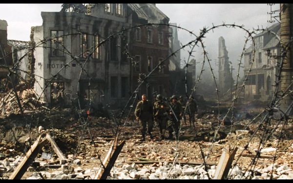 A dramatic HD wallpaper from the movie Saving Private Ryan, depicting soldiers navigating through a war-torn landscape filled with debris and barbed wire.