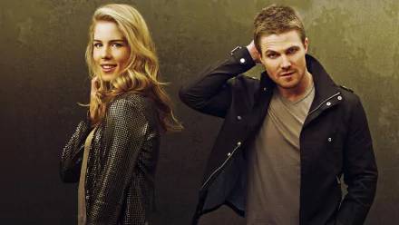 HD desktop wallpaper featuring Stephen Amell and Emily Bett Rickards from the TV show Arrow, with both actors posing confidently against a neutral background.