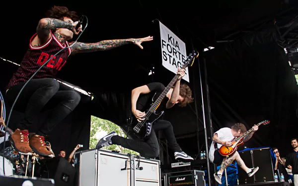 Live performance by Bring Me The Horizon captured in high energy, featured in an HD PC desktop wallpaper and background highlighting dynamic stage presence and music.