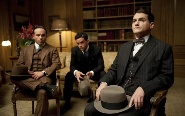 HD PC desktop wallpaper featuring a scene from the TV show Boardwalk Empire, with three men in vintage suits seated in a richly decorated room.