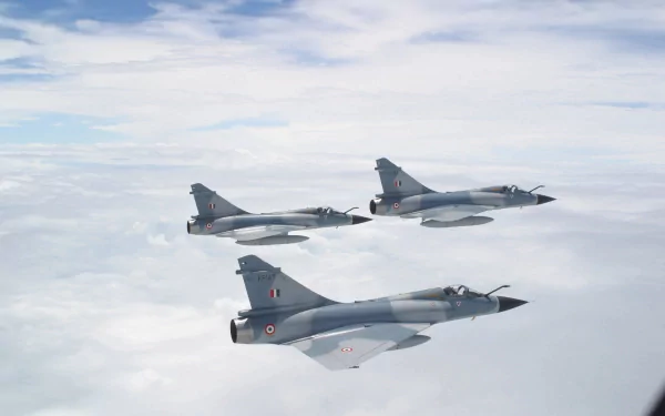 A striking HD desktop wallpaper featuring three Dassault Mirage 2000 fighter jets soaring through a clear sky, showcasing their sleek design and military prowess.