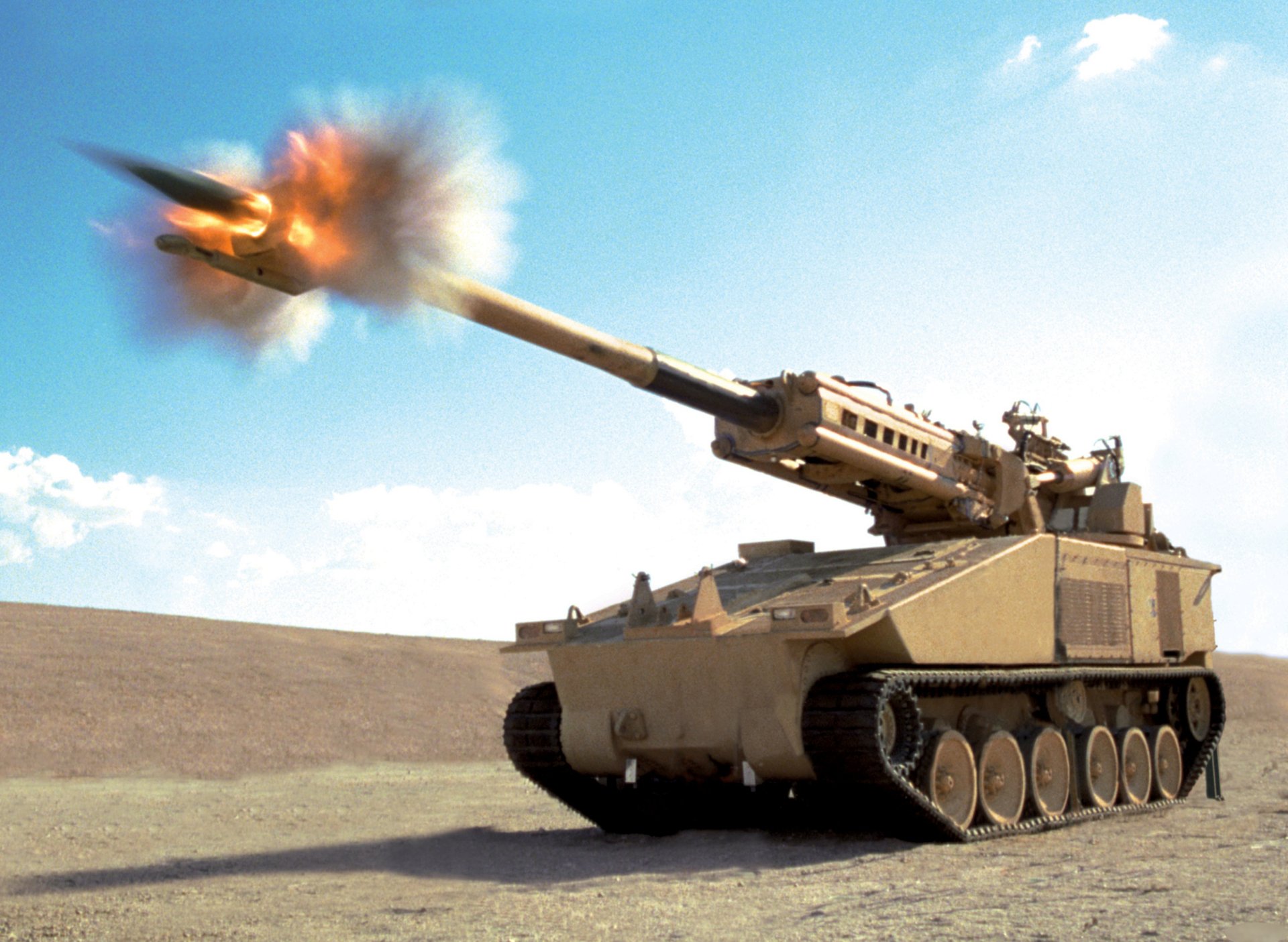 HD desktop wallpaper showcasing a military artillery tank firing a shell in a desert landscape under a clear blue sky.