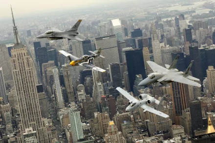 A stunning HD desktop wallpaper showcasing a formation of military jet fighters, including the McDonnell Douglas F-15 Eagle, General Dynamics F-16 Fighting Falcon, and Fairchild Republic A-10 Thunderbolt II, over a cityscape.