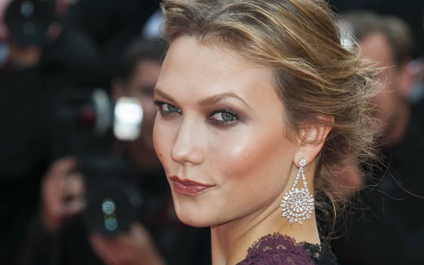 Close-up portrait of celebrity Karlie Kloss with elegant makeup and earrings, captured in 4K Ultra HD quality for a PC desktop wallpaper.