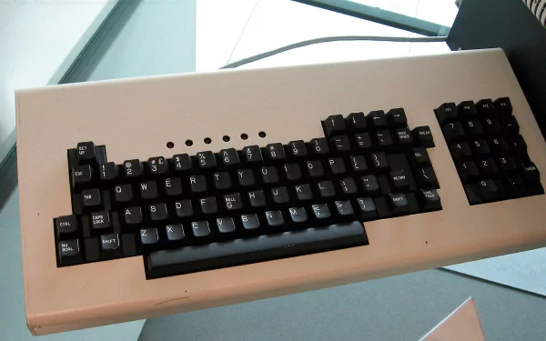 A high-definition desktop wallpaper featuring a vintage computer keyboard, showcasing a mix of technology and nostalgia in a sleek design.
