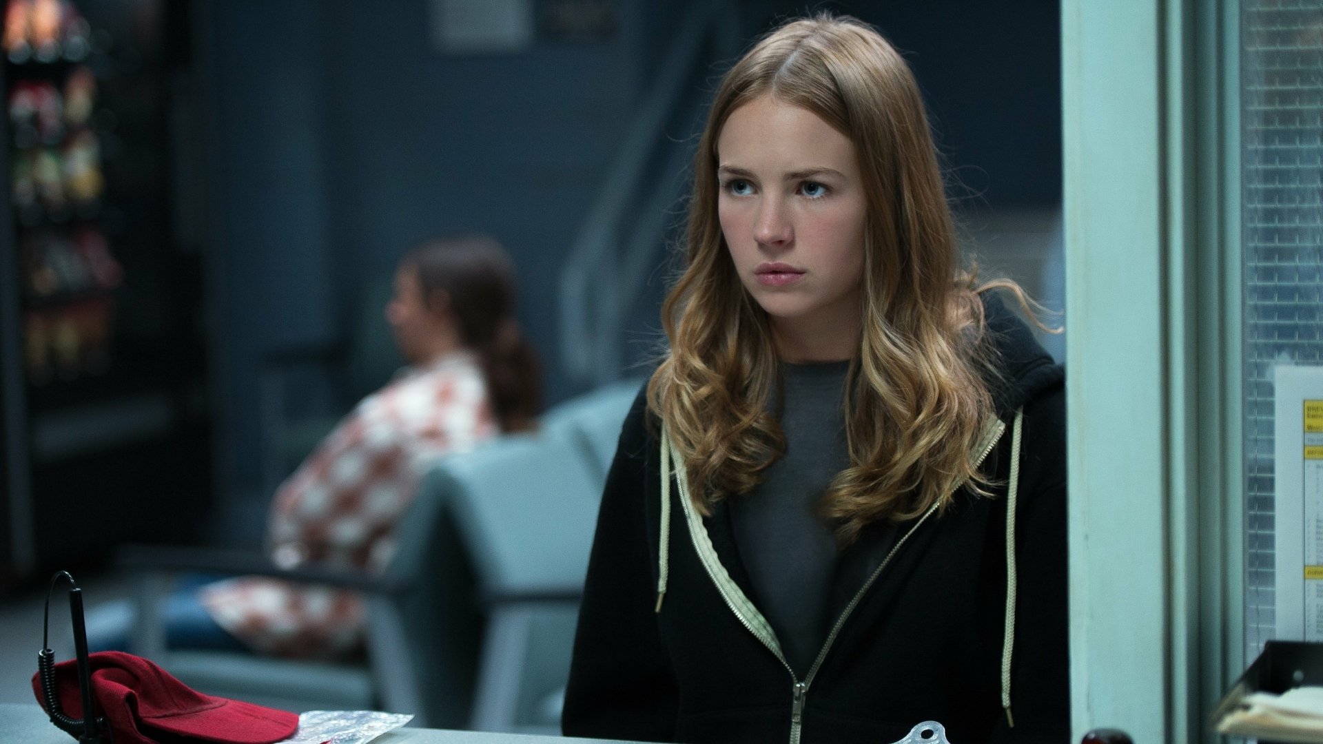 Brittany Robertson in a scene from the movie Tomorrowland, featured in a HD PC desktop wallpaper background.