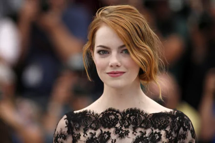 HD PC desktop wallpaper featuring a close-up of celebrity Emma Stone in an elegant black lace outfit with soft waves in her red hair.