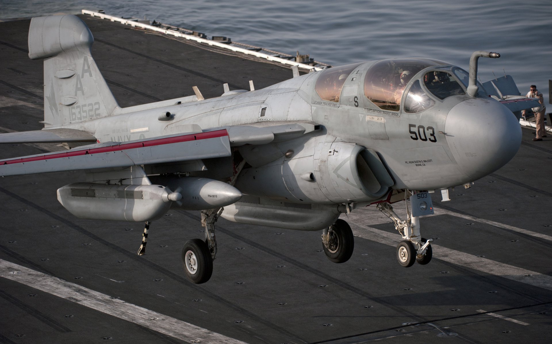 Navy Northrop Grumman EA-6B Prowler aircraft preparing for takeoff on an aircraft carrier deck, captured in high-definition for a desktop wallpaper.