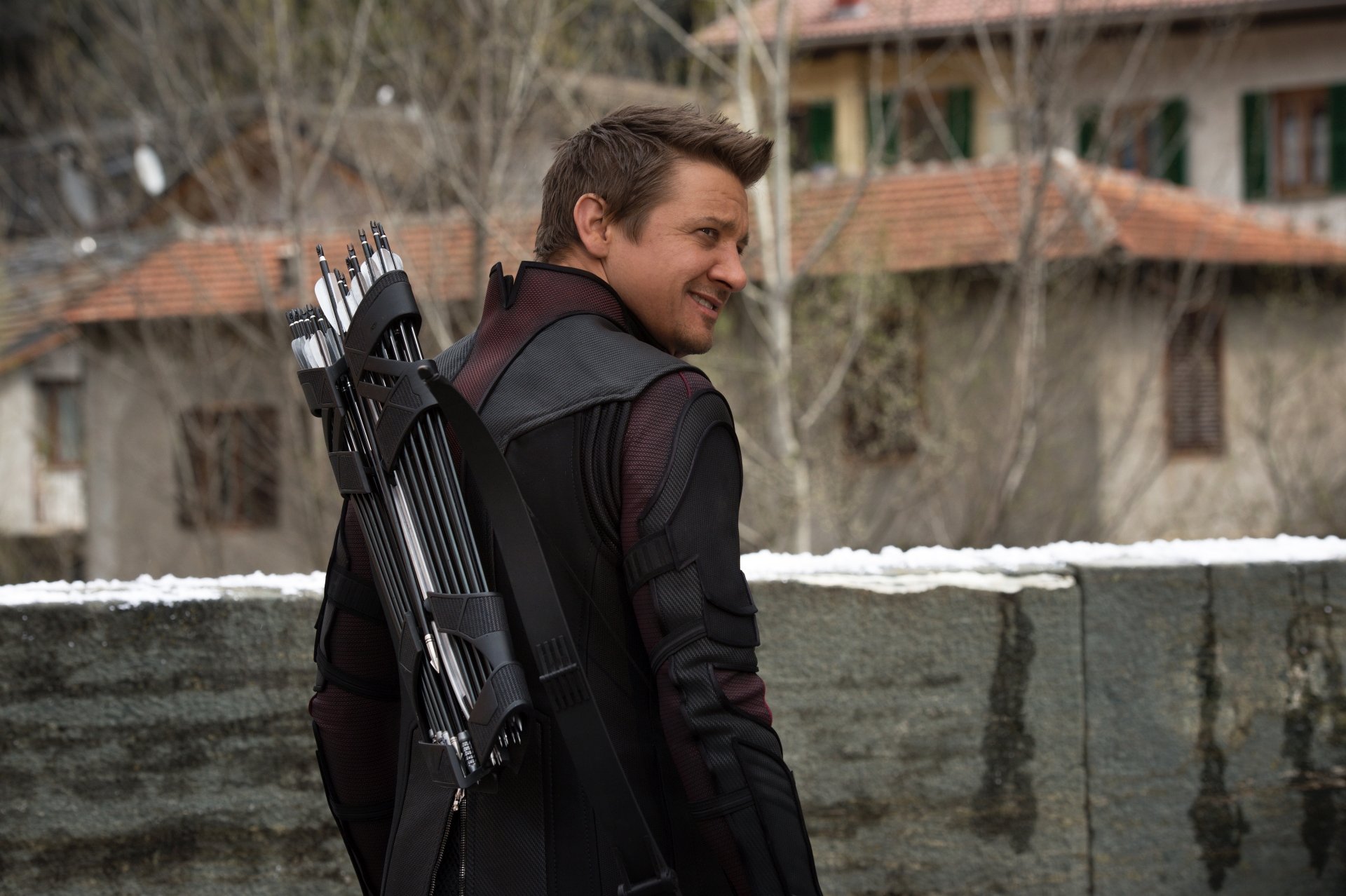 Jeremy Renner as Hawkeye in Avengers: Age of Ultron, shown with his bow and quiver, featured in a 4K Ultra HD PC desktop wallpaper and background.