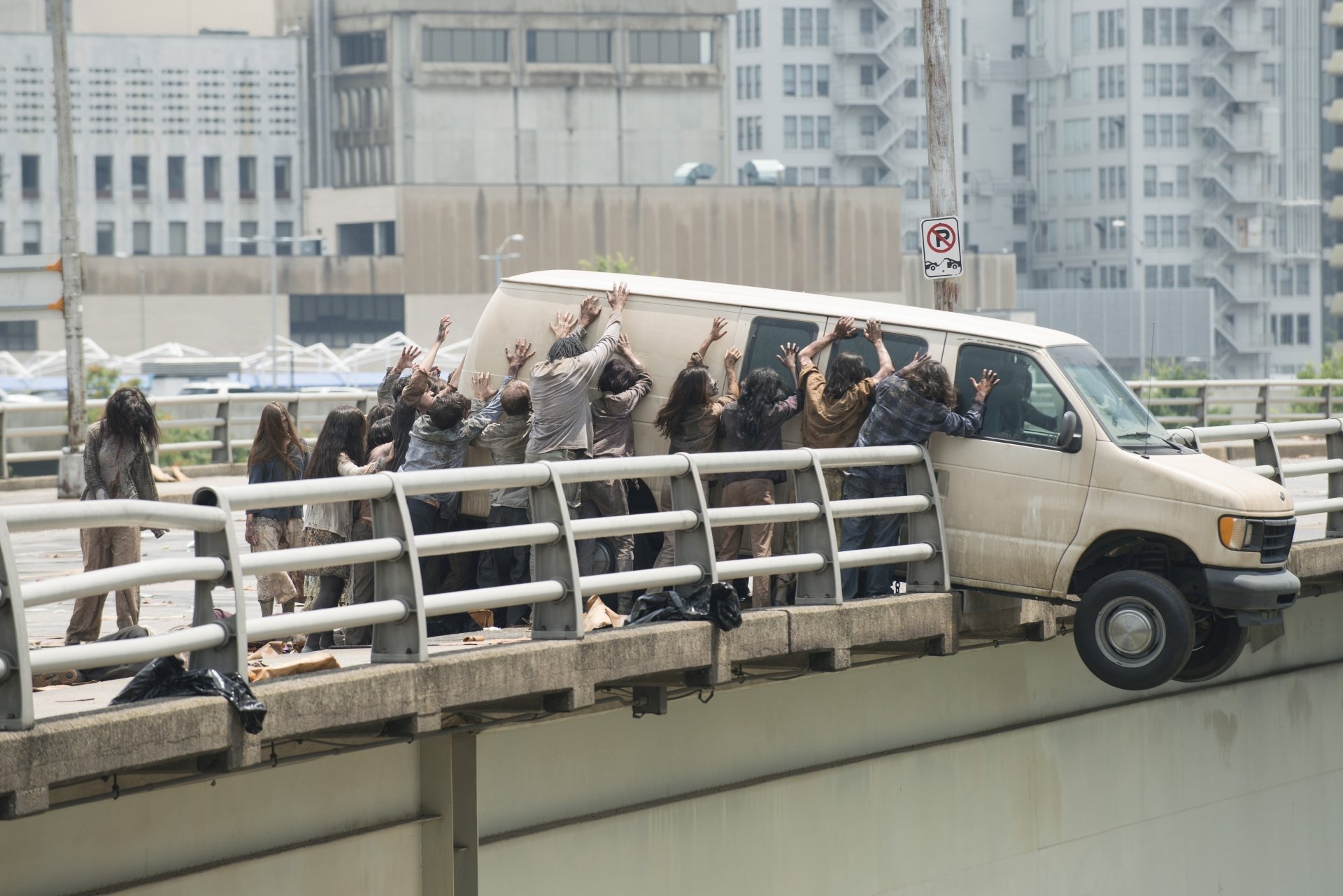 The Walking Dead TV show scene: survivors pinned in a van on a bridge as walkers swarm around them, 5K Ultra HD PC desktop wallpaper/background.