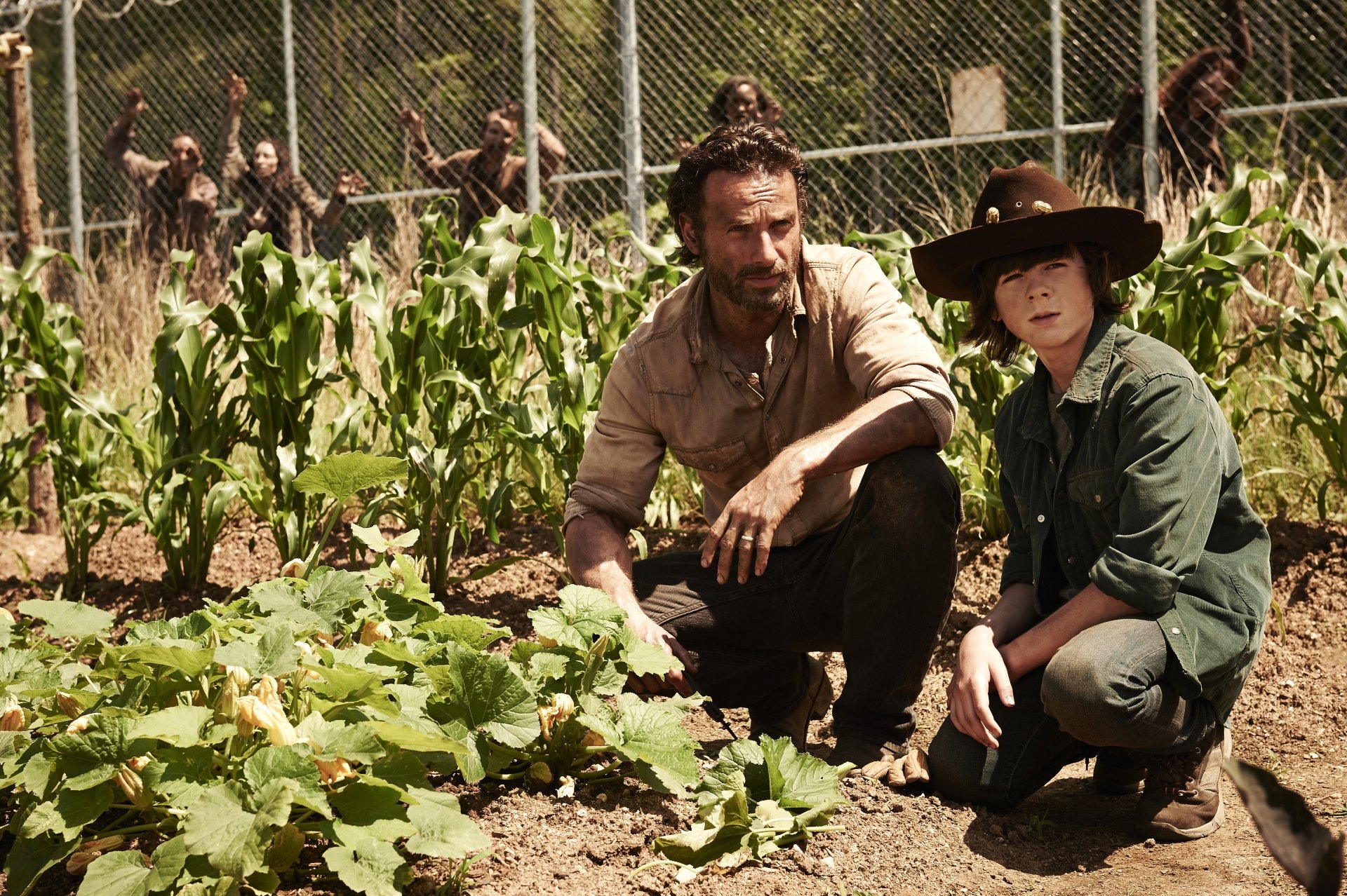 Rick Grimes and Carl Grimes from The Walking Dead TV show are shown tending to a garden in a 4K Ultra HD PC desktop wallpaper and background.