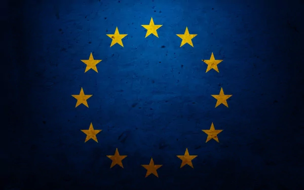A vibrant HD desktop wallpaper featuring the European Union flag, showcasing a circle of yellow stars on a deep blue background.