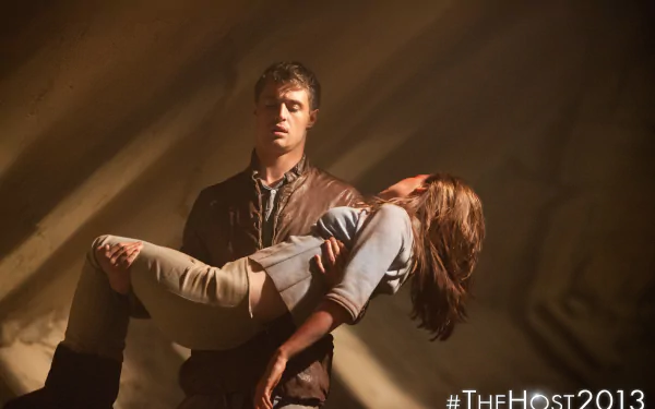 Max Irons and Saoirse Ronan in a gripping scene from The Host (2013), showcasing a dramatic moment with intense emotions in a captivating 4K Ultra HD wallpaper.
