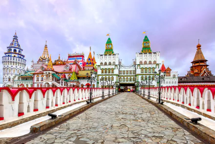Colorful Russian architecture at the Moscow Kremlin, showcasing intricate rooftops and a stone pathway under a pastel sky. A stunning 4K Ultra HD wallpaper of this iconic cityscape.