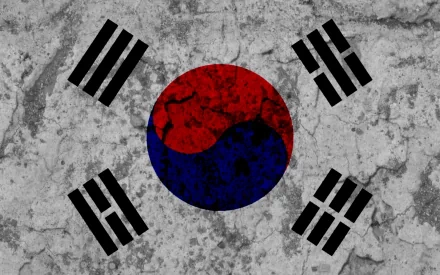 HD PC desktop wallpaper: South Korea flag (taegeuk) painted on cracked concrete, red-blue yin-yang disk center with four black trigrams.
