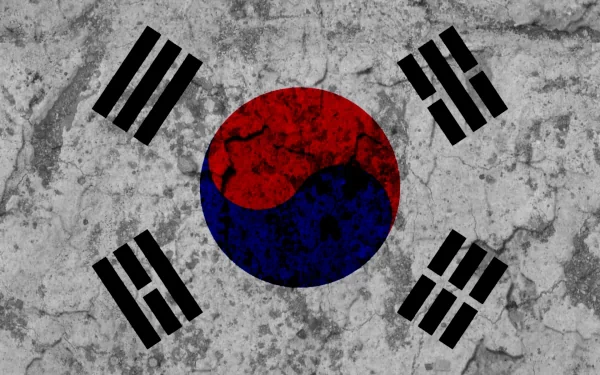 HD PC desktop wallpaper: South Korea flag (taegeuk) painted on cracked concrete, red-blue yin-yang disk center with four black trigrams.