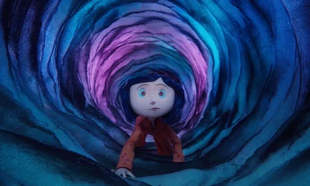 A captivating HD wallpaper featuring Coraline as she explores a vibrant, swirling tunnel, embodying the enchanting and eerie atmosphere of the animated film.