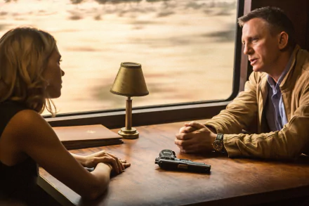 Léa Seydoux as Madeleine Swann and Daniel Craig as James Bond in a tense scene from the movie Spectre, set in an elegant train compartment with dramatic lighting.