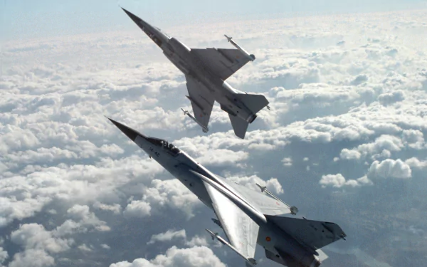 Two Dassault Mirage F1 military jets aircraft/airplane soaring above a cloudscape, captured as a 4K Ultra HD PC desktop wallpaper and background.