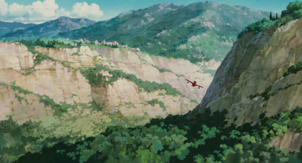 Anime Porco Rosso HD PC desktop wallpaper background: red seaplane soars between sunlit cliffs over a lush green valley with a distant village and blue mountain sky.