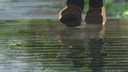 A serene scene from the anime The Garden of Words, featuring a close-up of feet walking on a rain-soaked pathway, reflecting the lush greenery around. HD wallpaper for a tranquil backdrop.