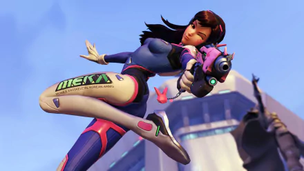 HD desktop wallpaper featuring D.Va from the video game Overwatch, striking a dynamic pose against a blue sky and a futuristic building backdrop.