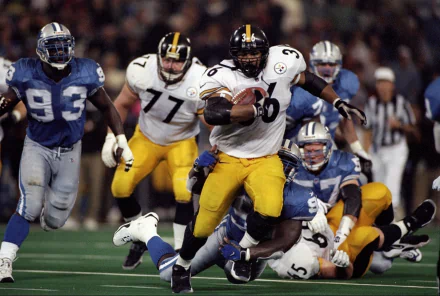 HD PC desktop wallpaper featuring a dynamic action shot of Pittsburgh Steelers players in a football game, capturing their intensity and sportsmanship on the field.