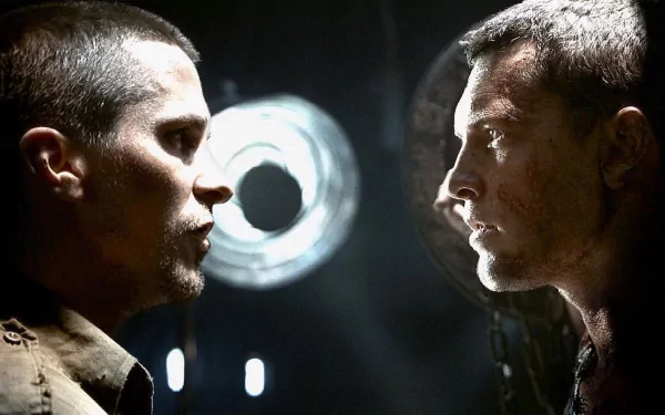 A dramatic face-off between two characters from The Terminator, set against a dark background with striking lighting. This HD desktop wallpaper captures the tension of the iconic film.