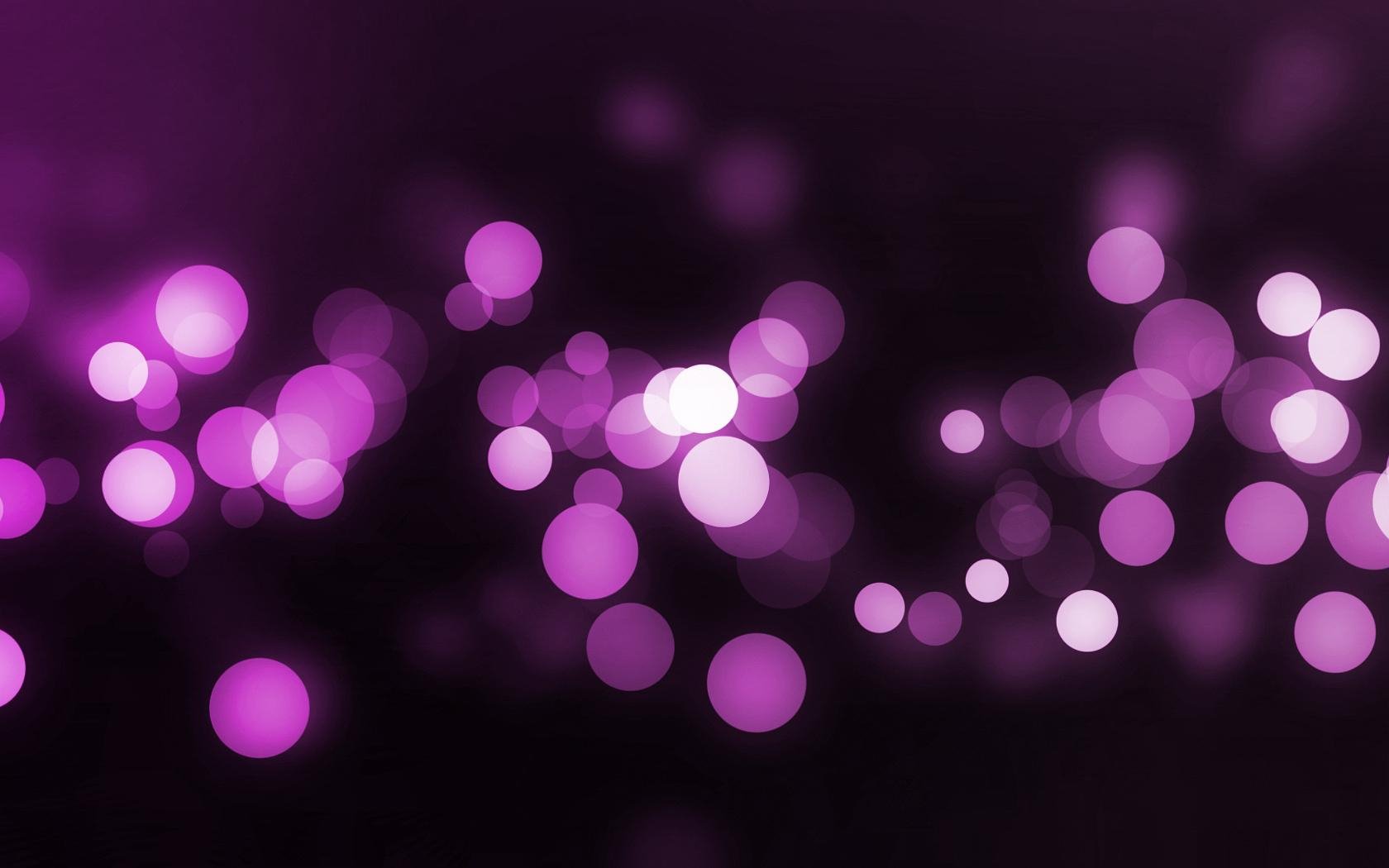 Artistic HD PC desktop wallpaper featuring vibrant purple and pink bokeh lights creating a colorful and abstract background.
