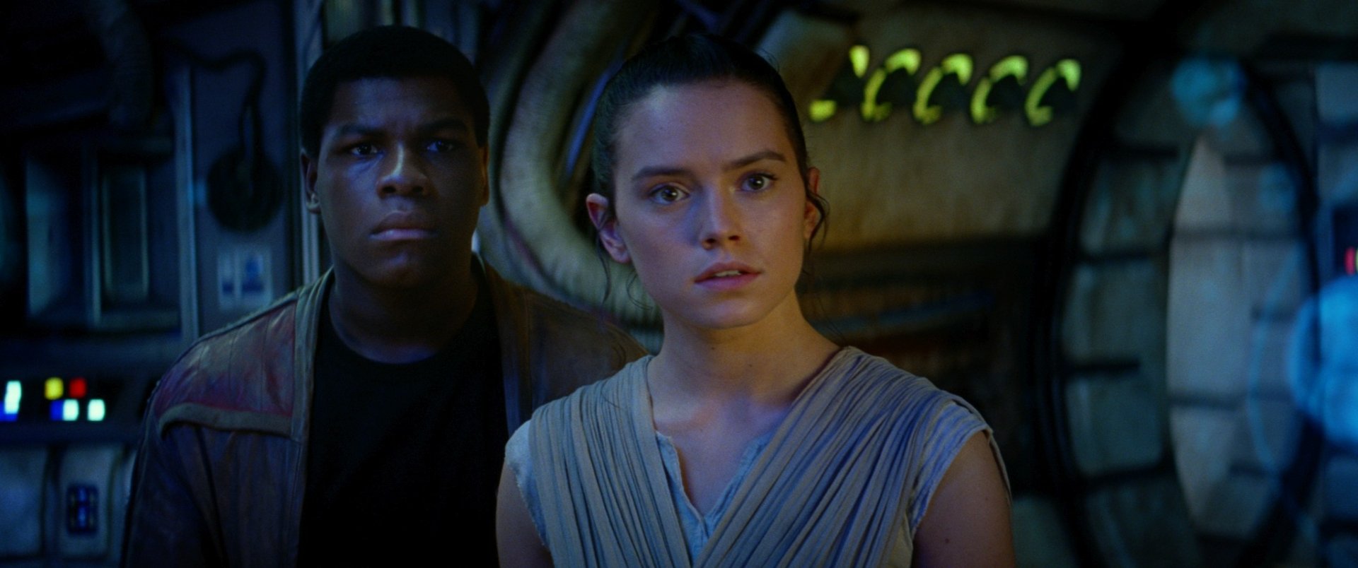 Daisy Ridley as Rey and John Boyega as Finn in a dramatic scene from Star Wars Episode VII: The Force Awakens, featured as an HD desktop wallpaper.