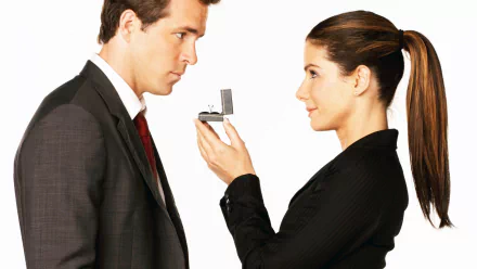 HD desktop wallpaper featuring Sandra Bullock as Margaret Tate offering an engagement ring to Ryan Reynolds in the movie The Proposal.