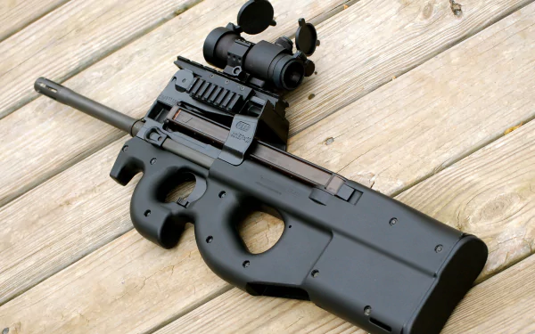 A detailed HD wallpaper featuring the FN PS90, a man-made firearm, showcasing its sleek design and mounted optics on a wooden surface.