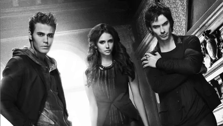 Three characters from the TV show *The Vampire Diaries* are featured in a striking black and white HD wallpaper, exuding a moody and mysterious atmosphere.