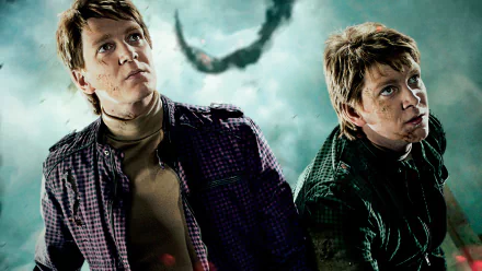High-definition wallpaper from Harry Potter and the Deathly Hallows: Part 2, featuring characters looking upward with a dramatic background.