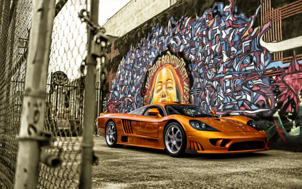 Orange Saleen S7 supercar parked in front of a colorful urban mural, captured in sharp detail for a 4K Ultra HD PC desktop wallpaper and background.
