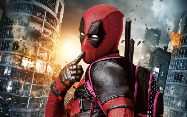 HD desktop wallpaper of Deadpool standing amidst exploding skyscrapers with a thoughtful pose and backpack, from the movie Deadpool.
