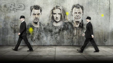 HD PC desktop wallpaper featuring characters from the TV show Fringe, depicted as graffiti portraits on a concrete wall with two men in black suits walking past.