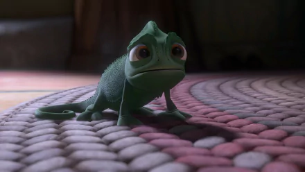 HD PC desktop wallpaper and background from the movie Tangled: Pascal the green chameleon perched on a braided rug, bathed in soft, warm lighting.