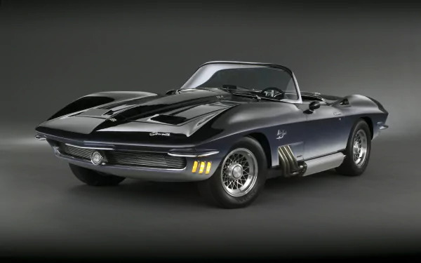 Chevrolet Corvette Mako Shark convertible in metallic blue, studio shot for 4K Ultra HD PC desktop wallpaper, classic Chevrolet sports vehicle.