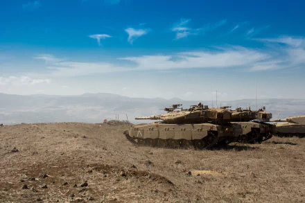 4K Ultra HD wallpaper featuring Merkava military tanks positioned on a barren hillside under a clear blue sky.