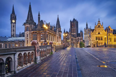 A stunning night view of Ghent, Belgium, showcasing its intricate architecture, illuminated buildings, and cobblestone streets, creating a captivating man-made landscape.