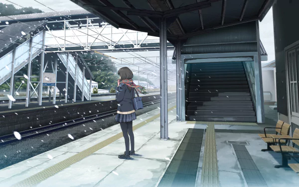 A serene anime scene at a train station, featuring a girl in a school uniform waiting as snow gently falls, creating a peaceful atmosphere for an HD desktop wallpaper.